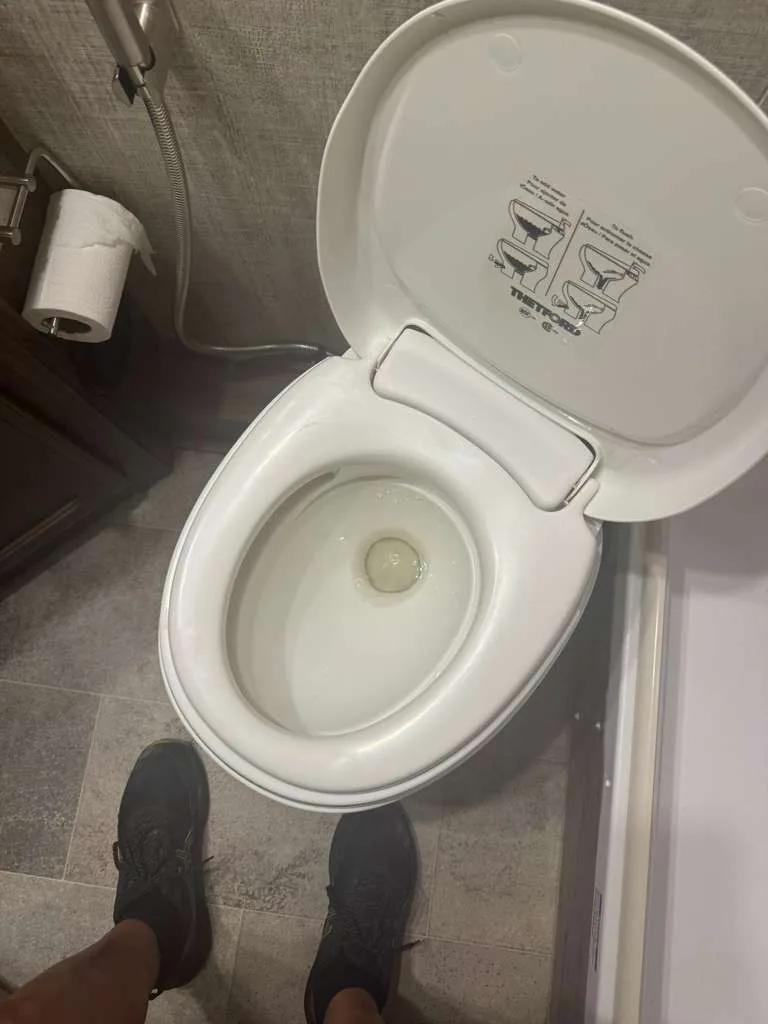 RV toilet replacement on-site by a Coast to Coast RV technician